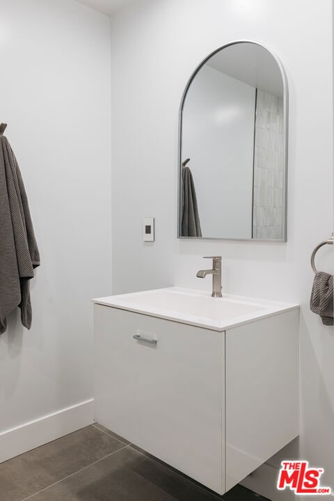 bathroom featuring vanity and tile patterned flooring