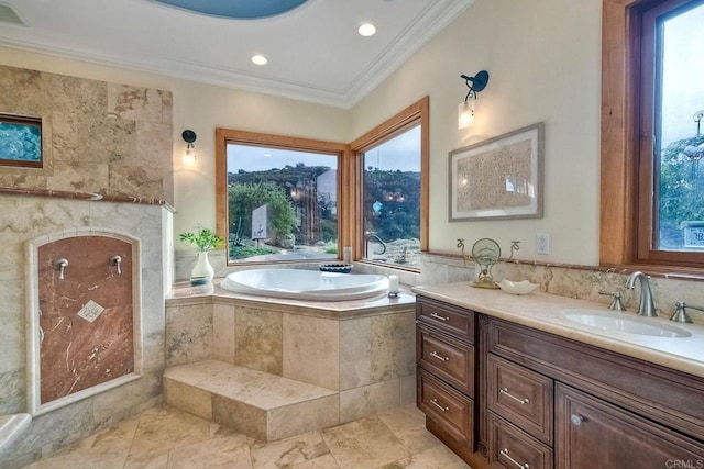 bathroom with vanity, tiled bath, and crown molding