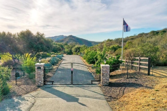 view of gate featuring a mountain view