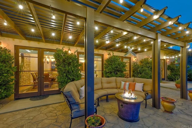 view of patio featuring a pergola, french doors, and an outdoor living space with a fire pit