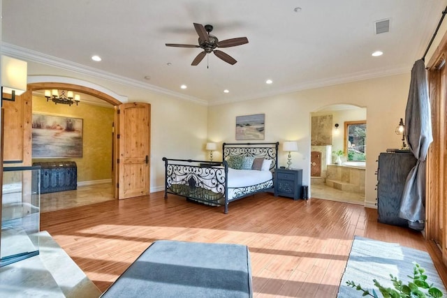 bedroom with crown molding, ceiling fan with notable chandelier, and hardwood / wood-style flooring