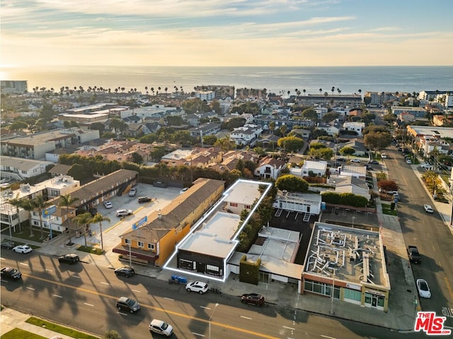 aerial view at dusk with a water view