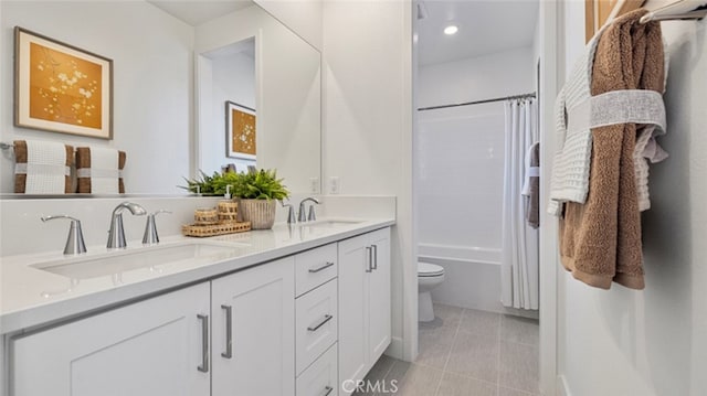 full bathroom with vanity, toilet, and shower / bath combo with shower curtain