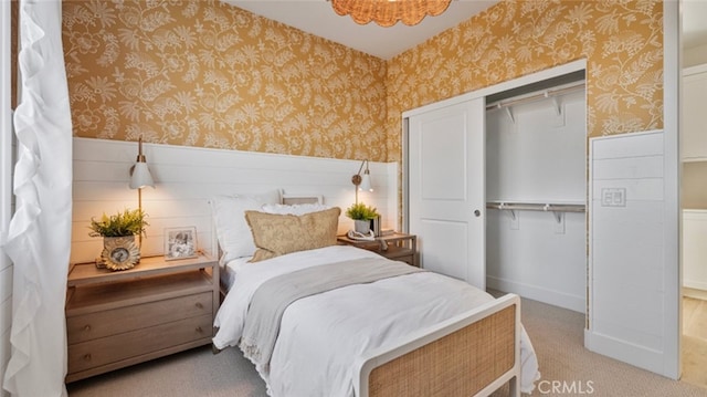 carpeted bedroom featuring a closet