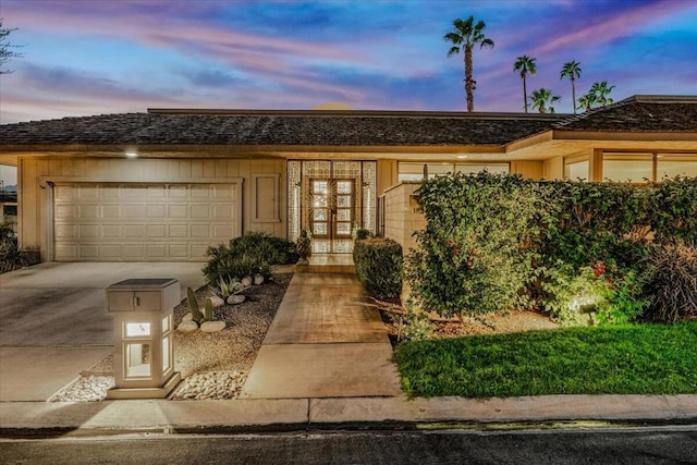 ranch-style home with a garage