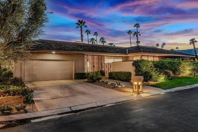 single story home with a garage