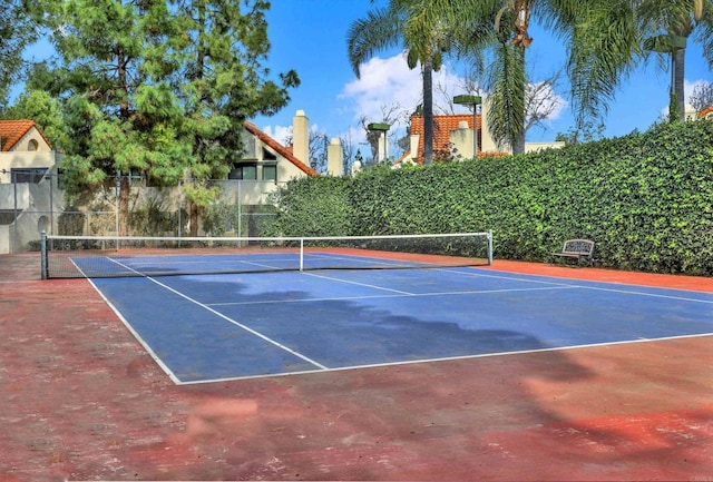 view of sport court with basketball hoop