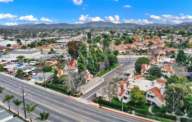 birds eye view of property featuring a mountain view