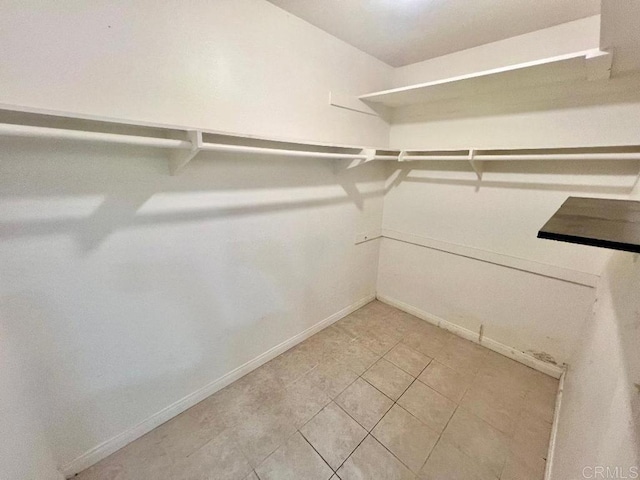 walk in closet featuring tile patterned floors