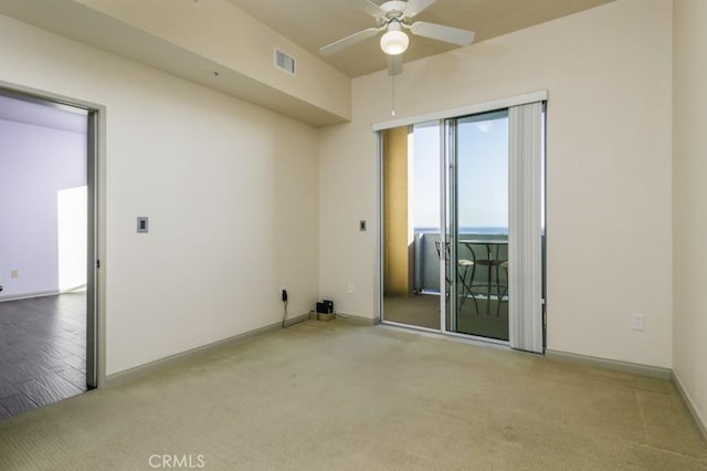 carpeted empty room with ceiling fan