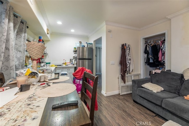 living room featuring dark hardwood / wood-style floors and ornamental molding