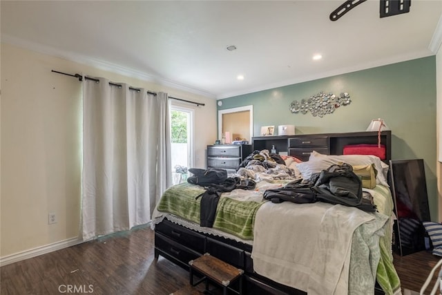 bedroom featuring wood-type flooring and ornamental molding