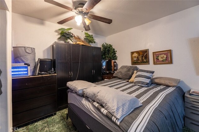 bedroom featuring ceiling fan