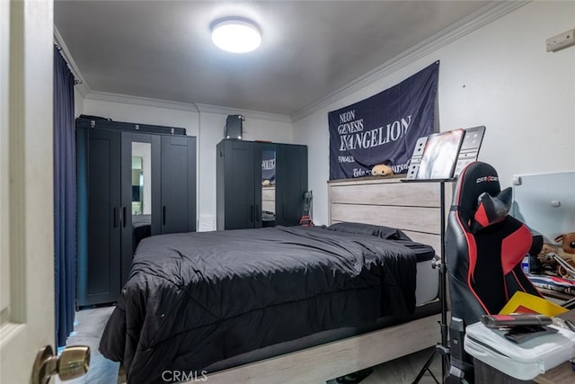 bedroom featuring crown molding