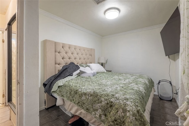 bedroom featuring ornamental molding and parquet flooring