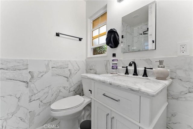 bathroom with vanity and tile walls