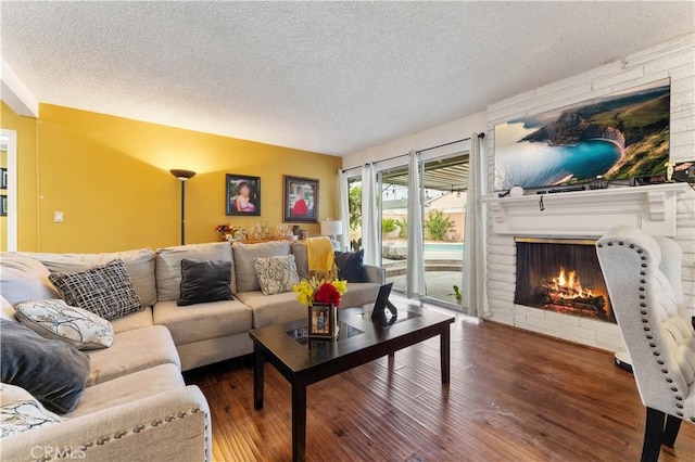 living room with hardwood / wood-style floors and a textured ceiling