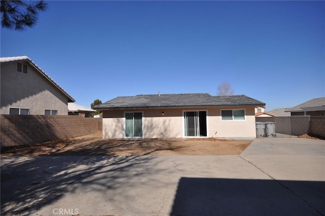 back of property with a patio area