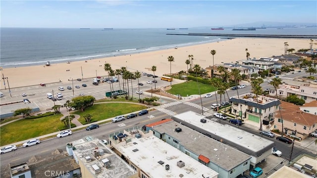 aerial view featuring a view of the beach and a water view