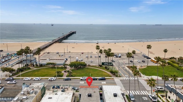 aerial view featuring a view of the beach and a water view