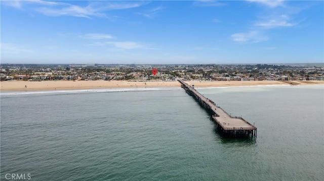 exterior space featuring a water view and a view of the beach