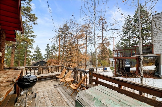 wooden deck with grilling area