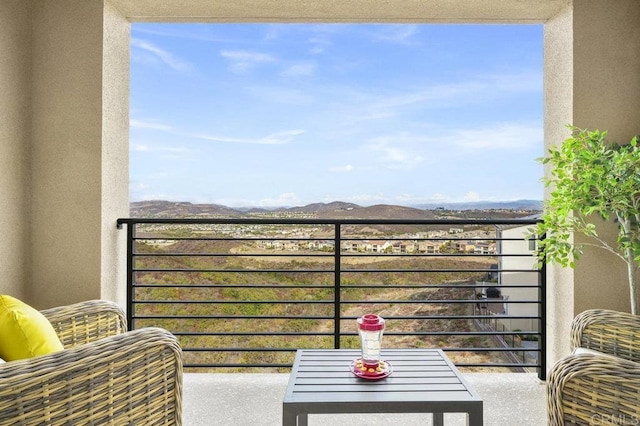 balcony featuring a mountain view