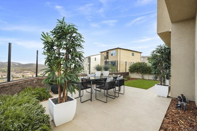 view of patio / terrace featuring a mountain view