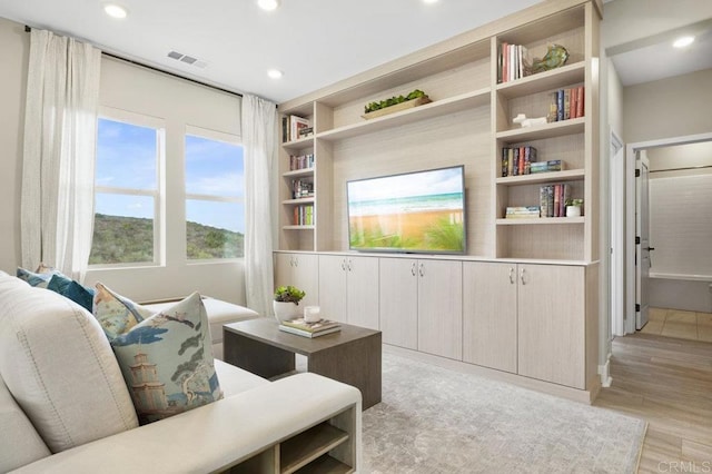 living room with light hardwood / wood-style floors