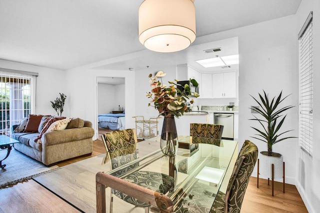 dining space featuring light hardwood / wood-style flooring