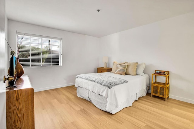 bedroom with light wood-type flooring