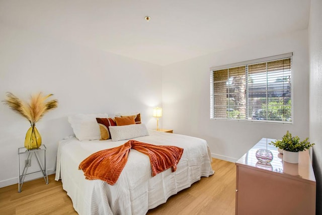 bedroom with light wood-type flooring