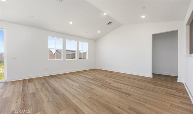 unfurnished room with lofted ceiling, light wood-style flooring, recessed lighting, and baseboards