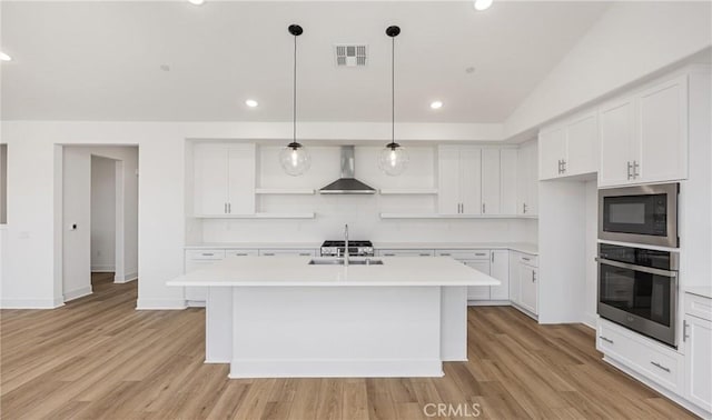kitchen featuring oven, wall chimney exhaust hood, open shelves, built in microwave, and light countertops