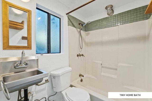 full bathroom featuring toilet, sink, and  shower combination