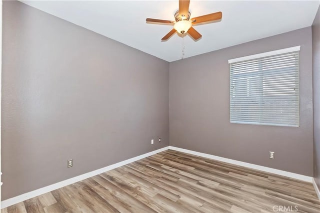 unfurnished room featuring ceiling fan and light hardwood / wood-style flooring