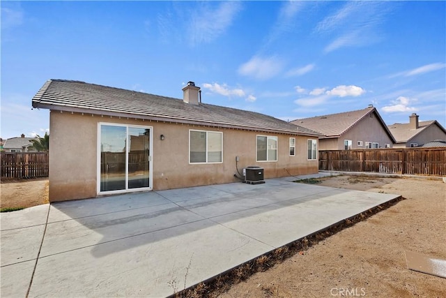 rear view of property featuring a patio area and central air condition unit