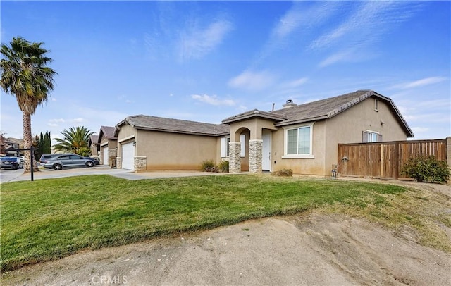 view of front of property featuring a front lawn and a garage