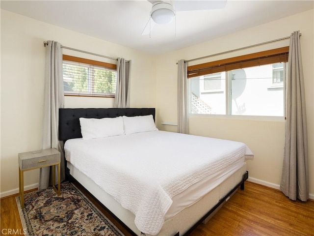 bedroom featuring hardwood / wood-style floors and ceiling fan