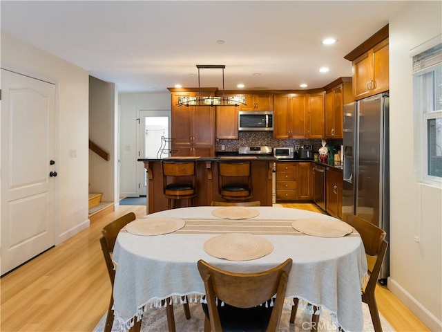 dining space featuring light hardwood / wood-style flooring