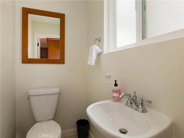 bathroom with sink and toilet