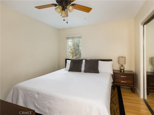 bedroom featuring light hardwood / wood-style flooring and ceiling fan