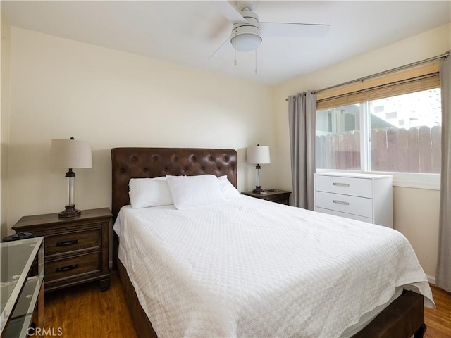 bedroom featuring dark wood-type flooring and ceiling fan