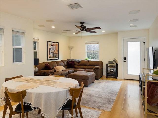 dining area featuring ceiling fan and light hardwood / wood-style flooring