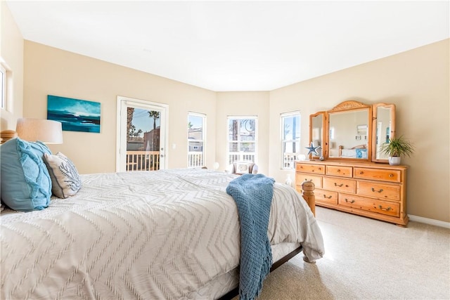 bedroom featuring access to outside, carpet flooring, and baseboards