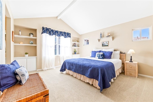 bedroom with lofted ceiling with beams, carpet, and baseboards