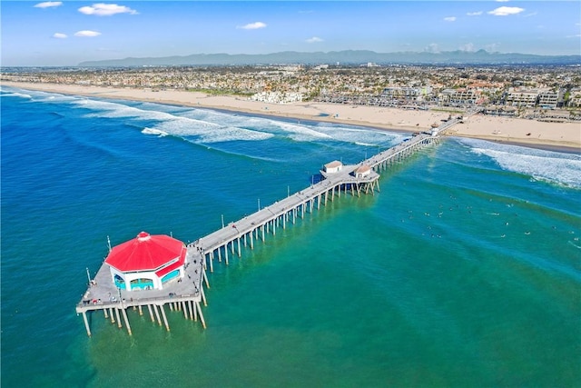 birds eye view of property featuring a water view and a view of the beach