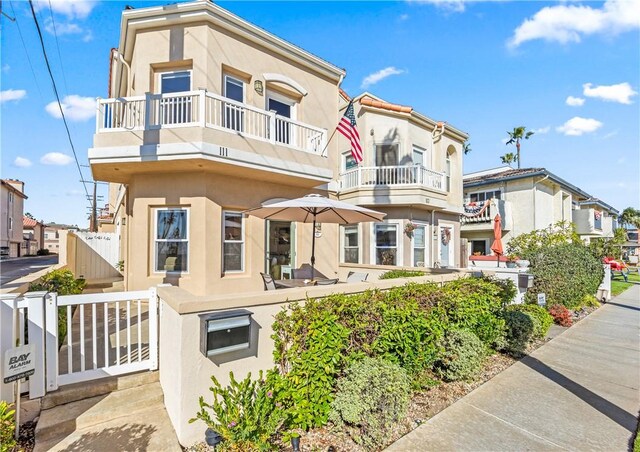 view of front of home with a balcony