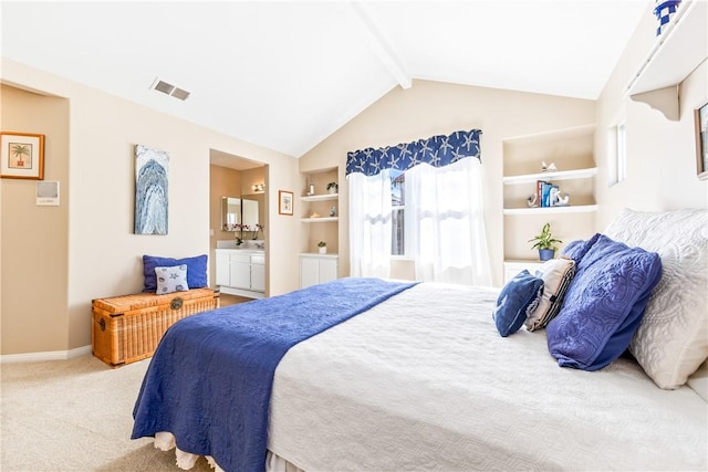 carpeted bedroom with vaulted ceiling with beams, ensuite bath, baseboards, and visible vents