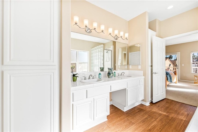 bathroom with vanity and hardwood / wood-style flooring